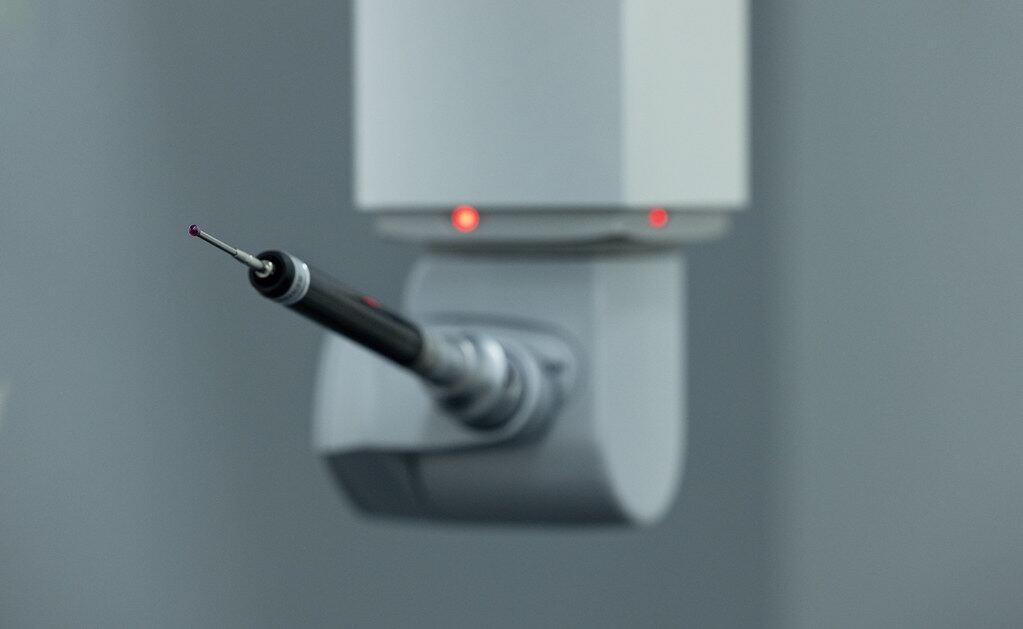 CMM probe measuring a precision part