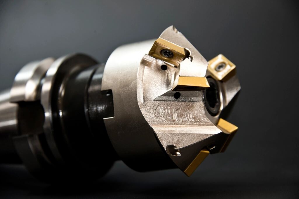Indexable face mill with carbide inserts in a CNC tool holder